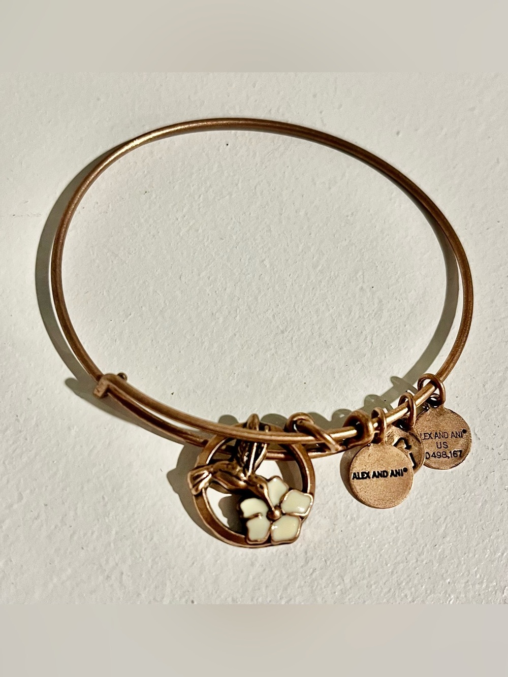 Alex and Ani Bangle with Cream Hummingbird and Flower Charm